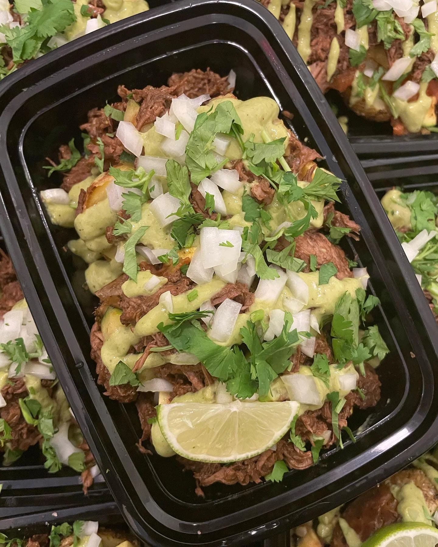 NE TIME Meals beef barbacoa stuffed baked potato topped with onions and herbs